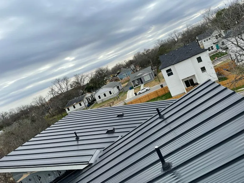 Standing seam metal roof panels with vents for Skylight Repair in Bastrop